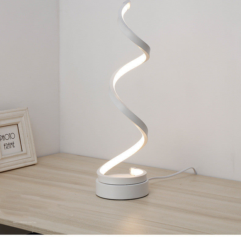 Moodly Helix spiral LED table lamp in white on a desk