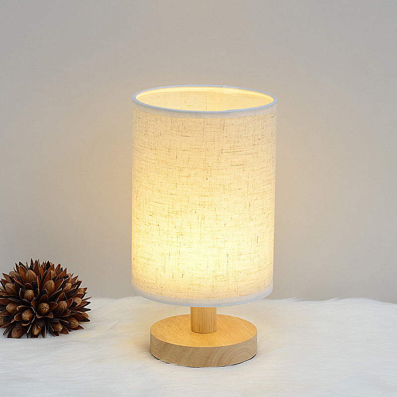 Moodly Nook table lamp with a grey linen shade, switched on