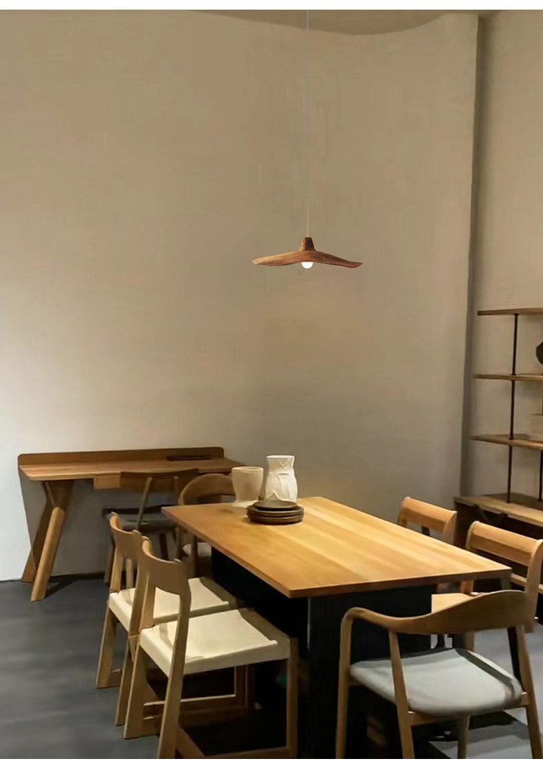 Moodly Dune pendant light above a wooden dining table