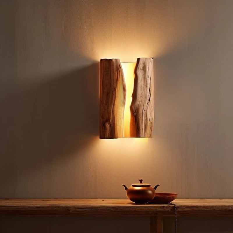 Moodly Grain wooden wall lamp lighting the wall above a shelf