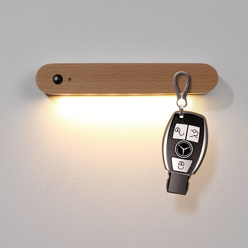 Moodly Entry wooden sensor light with a car key on the hook