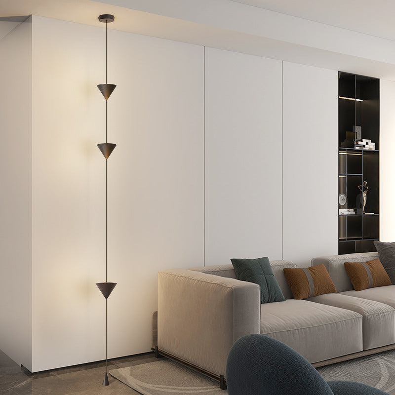 Moodly Line lamp in front of a white wall in a living room
