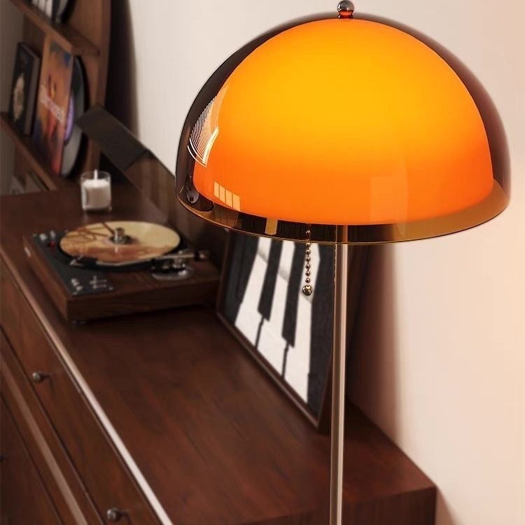 Close-up of the amber dome shade of the Moodly Amber floor lamp